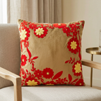 Phoolwari Red floral cushion on an oak lounge chair in a living room