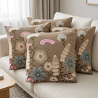 Brown floral cushion set of five on an ivory living-room sofa, front view