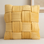 Yellow basket-weave cushion on a linen sofa