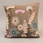 Brown floral cushion studio close-up showing embroidery and applique details
