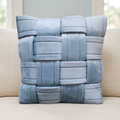 Blue basket-weave cushion on a linen sofa