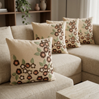 Beige Peach floral cushion set of five on an oatmeal sectional, angled view